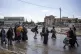 Palestinians flee from the city of Khan Younis in southern G