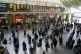 Passengers waiting for trains at London King's Cross Station