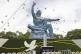 Doves fly over the Peace Statue during a ceremony to mark th