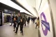 People using the Elizabeth Line service at Tottenham Court R