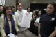 Akbayan Partylist representative Perci Cendana (centre) show