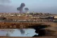 Smoke rises following an Israeli airstrike on buildings near