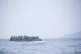 Refugees on a boat crossing the Mediterranean sea, heading f