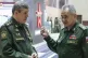 Russian Defence Minister Sergei Shoigu (right) gestures as h