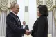 Russian President Vladimir Putin greets North Korean Foreign