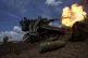 Ukrainian soldiers fire toward Russian positions at the fron