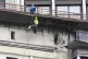 Municipal workers investigate the place after a downed Ukrai