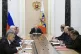 Russian President Vladimir Putin (centre) speaks at the Secu