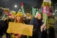 People take part in a protest organised by Stand Up to Racis