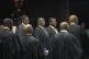 South African President Cyril Ramaphosa (centre) sings the n