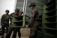 South Korean soldiers dismantle loudspeakers that set up for