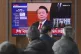 A TV screen shows footage of impeached South Korean Presiden