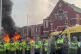 A police van set alight as trouble flares during a protest i