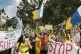People march during a mass demonstration against over touris