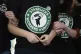 Starbucks employees and supporters link arms during a union 