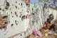 In this video frame, displaced Sudanese sit next to a bullet
