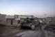 A destroyed Syrian army tank sits in the village of Anjara, 