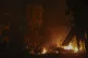 Vehicles burn after an airstrike against opposition fighters
