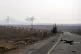 Smoke from fighting billows in the edges of the town of Hama