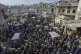 Relatives and neighbours attend the funeral procession for f