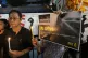 Thai activists hold a portrait of Netiporn Sanesangkhom, a m