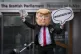 A protester wearing a giant Donald Trump head, outside Holyr