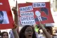 Members of the opposition and civil society groups shout slo