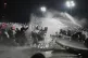 
Riot police officers clash with protesters during a protest