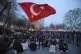 University students sit next to anti riot police officers du