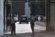 Omani security personnel watch a convoy believed to be carry