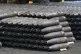 155 mm M795 artillery projectiles are stacked during manufac