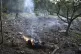 Flames burn in a crater following a Russian missile attack i