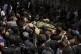 Mourners carry the body of Palestinian Jamal Saudi, 21, wrap