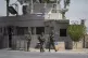 Israeli soldiers stand guard near the site of a deadly shoot