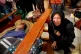 Gloria Quispe mourns next to the body of her brother Antonio