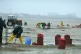 Cockle pickers back at work on the sands of Morcambe Bay, La