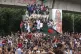Protesters climb a public monument as they celebrate after g