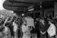 Mourners raise their hands in clenched-fist salutes as the c