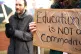 THE MESSAGE IS ON THE PLACARD: University of Birmingham staf