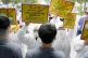 PUTTING THE BLAME WHERE IT BELONGS: Korean Health Workers Un