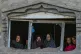 Palestinian women look at the destruction after an Israeli a