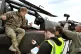 Prince Harry talks to a TV crew after his early morning pre-