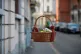 One of the baskets with food and other goods hanging from ba
