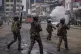 Police officers fire tear gas during a protest in Nairobi, K