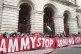 Activists protest outside the Foreign, Commonwealth, and Dev