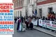 Protesters gather outside the Business and Trade department 