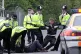 A protester is dragged away from the gates of Aldermaston, 2