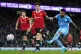 Manchester City's Riyad Mahrez (right) scores their side's f