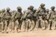 Polish troops march in Romania during last year's Defender E