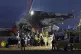 A rescue team carry the body of a passenger at the site of a